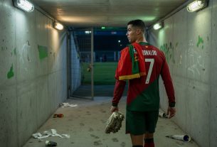 Cristiano Ronaldo walks alone down a dim stadium tunnel after Portugal’s 2026 World Cup