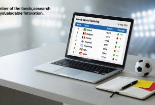 Editorial photo of a laptop showing a men’s football world ranking table dated 18